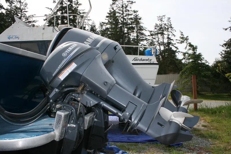 Slide: The Image of 2017 North River 2500 S Sew Hawk OS with Yamaha outboard motor, parked outdoors. - 48