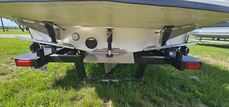 Slide: The Image of Rear view of a 2017 Tigé Z3 boat on a trailer, showing the hull and propeller. - 21