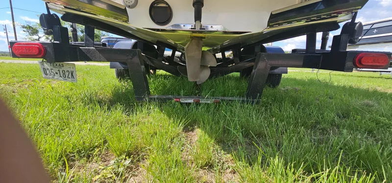 Slide: The Image of Rear view of a 2017 Tigé Z3 boat on a trailer, parked on grass. - 22