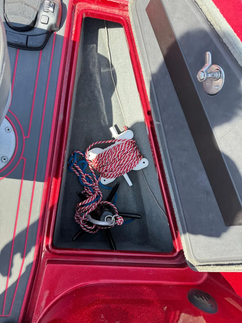 Slide: The Image of 2016 Yar-Craft 209TFX boat storage compartment with ropes and anchor. - 12