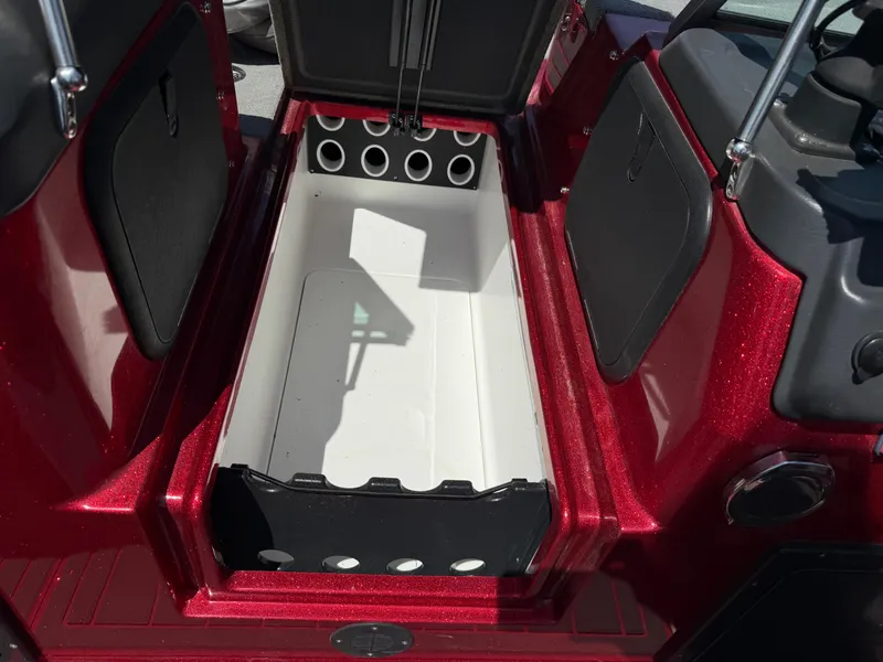 Slide: The Image of 2016 Yar-Craft 209TFX boat storage compartment with red exterior and open hatch. - 15