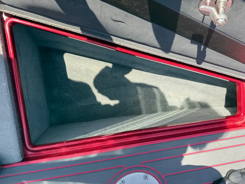 Slide: The Image of Interior compartment of 2016 Yar-Craft 209TFX boat with red trim. - 18