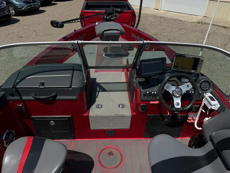 Slide: The Image of 2016 Yar-Craft 209TFX boat interior with steering wheel, dashboard, and seating. - 24