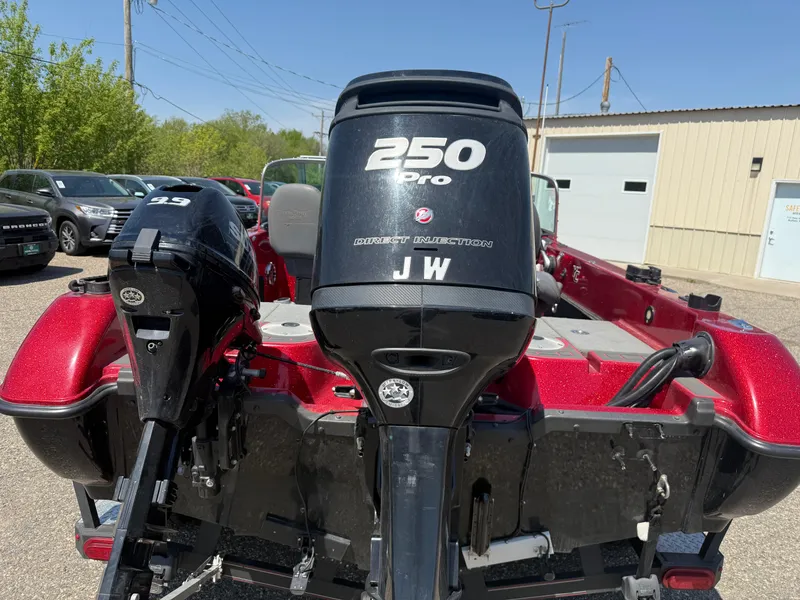 Slide: The Image of 2016 Yar-Craft 209TFX boat with dual outboard motors, parked outdoors. - 4