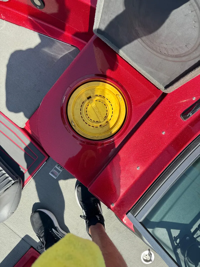 Slide: The Image of 2016 Yar-Craft 209TFX boat interior with red finish and yellow hatch cover. - 7