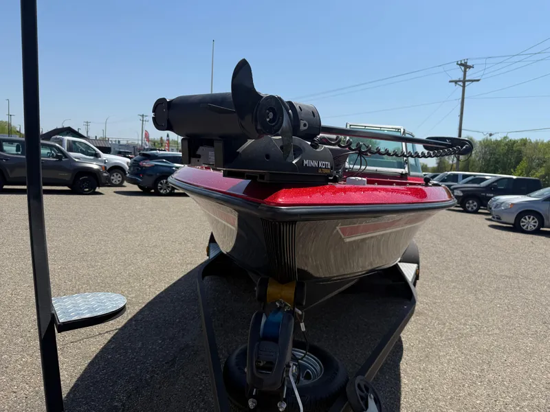 Slide: The Image of 2016 Yar-Craft 209TFX boat with Minn Kota motor in a parking lot. - 8