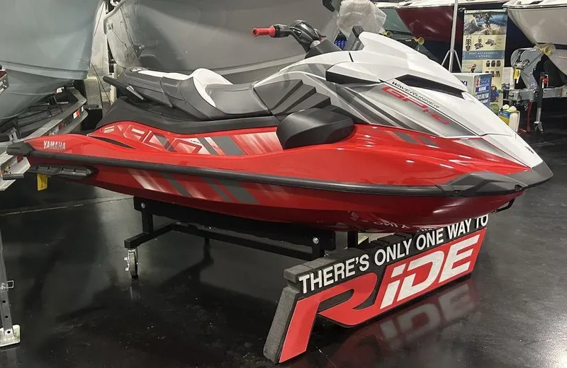 Slide: The Image of 2025 Yamaha WaveRunner GP HO™ with Audio, red and white, displayed indoors. - 1