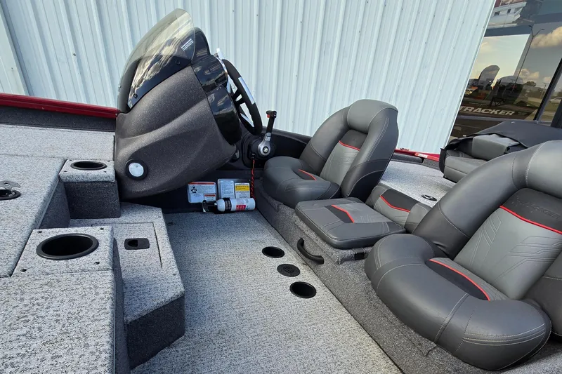 Slide: The Image of 2022 Tracker Pro Team 190 TX Tournament Edition boat interior with seating and console. - 4