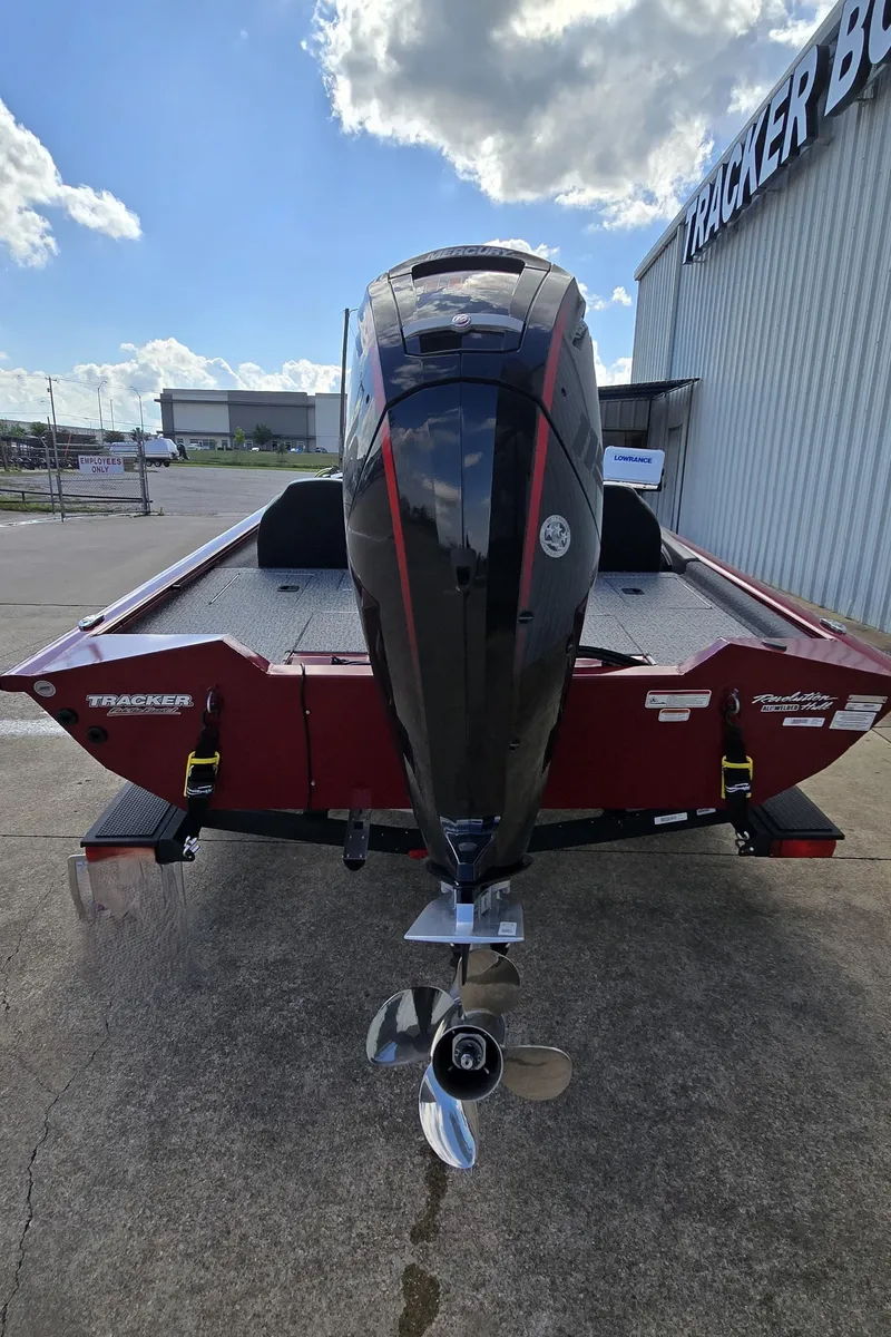 Slide: The Image of 2022 Tracker Pro Team 190 TX Tournament Edition boat, rear view with motor, outdoors. - 5