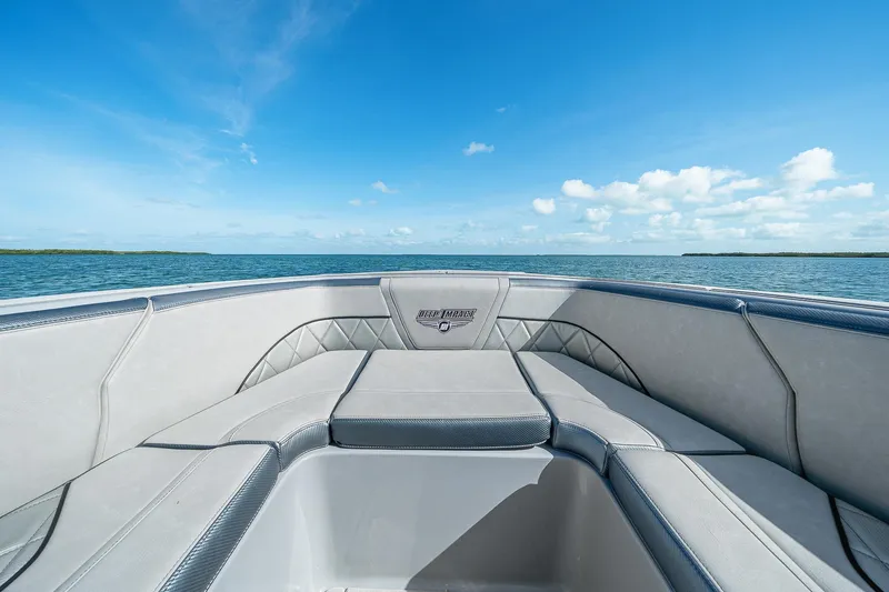 Slide: The Image of 2025 Deep Impact 369 Sport boat interior with ocean view under clear blue sky. - 11
