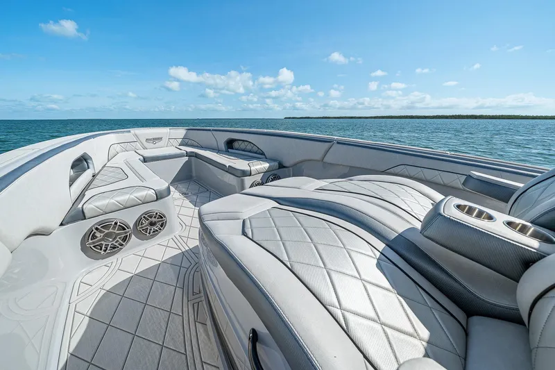 Slide: The Image of Luxurious 2025 Deep Impact 369 Sport boat interior with plush seating and ocean view. - 18