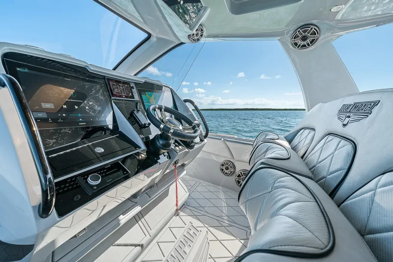 Slide: The Image of Interior of 2025 Deep Impact 369 Sport boat with modern dashboard and luxurious seating. - 35