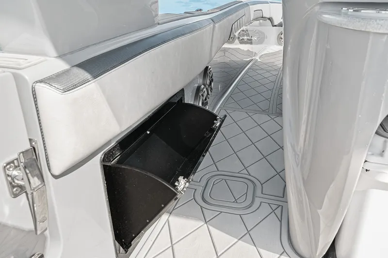 Slide: The Image of 2025 Deep Impact 369 Sport boat interior with open storage compartment and sleek design. - 41