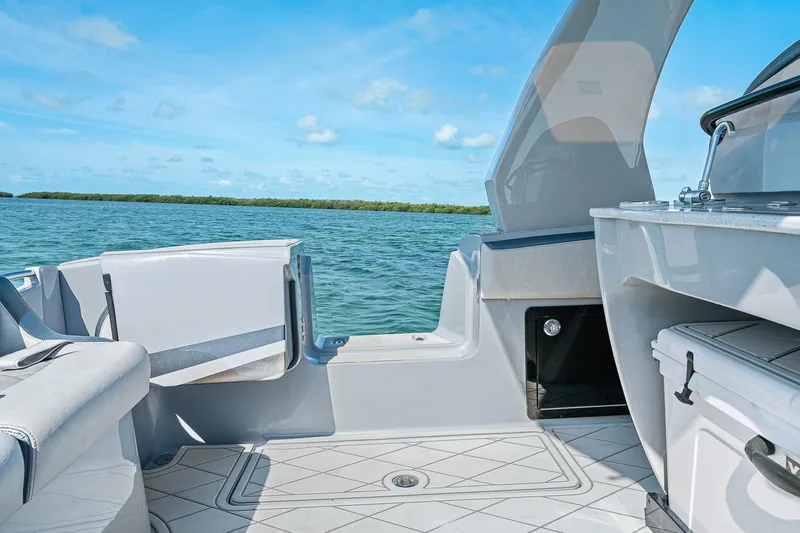 Slide: The Image of 2025 Deep Impact 369 Sport boat interior with open deck, ocean view, and clear blue sky. - 42