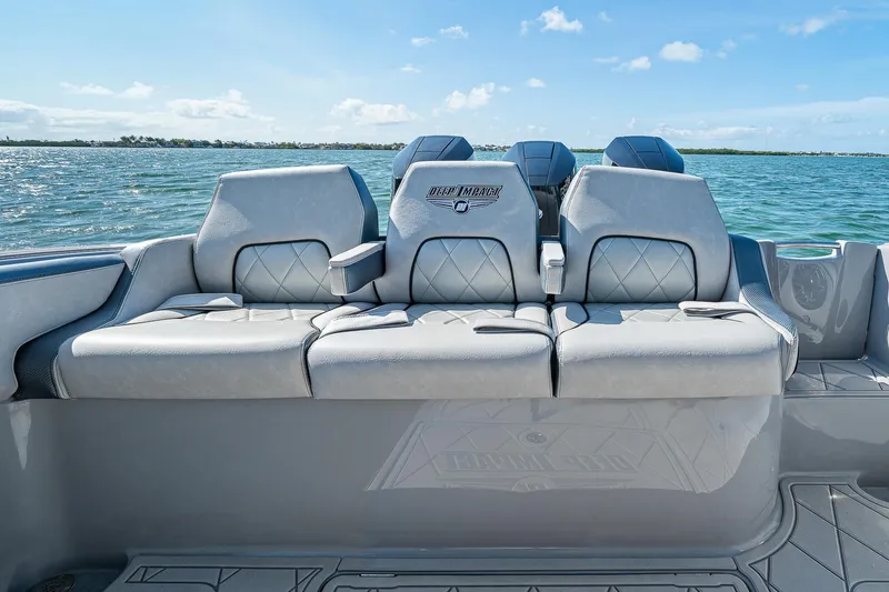 Slide: The Image of 2025 Deep Impact 369 Sport boat seating with ocean backdrop under clear skies. - 43