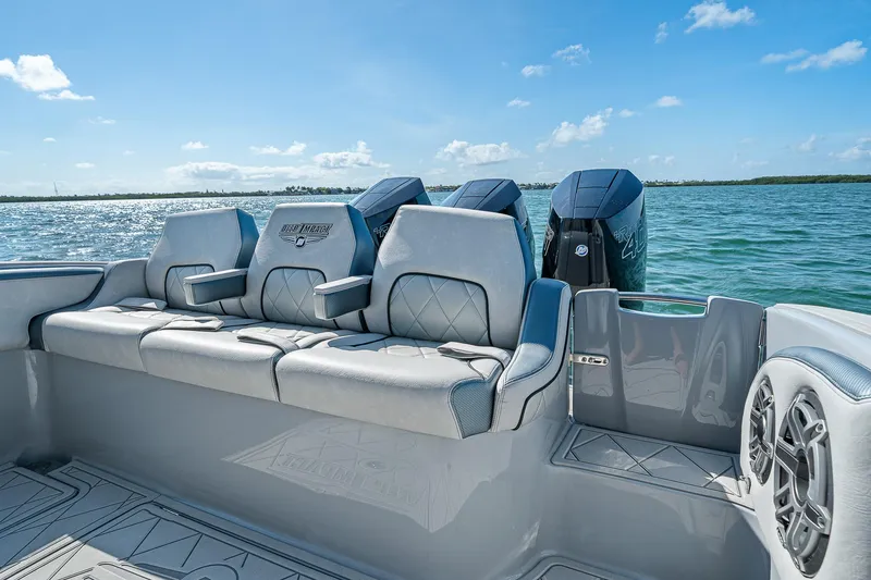 Slide: The Image of 2025 Deep Impact 369 Sport boat with luxurious seating and powerful engines on open water. - 44