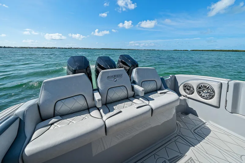 Slide: The Image of Luxury 2025 Deep Impact 369 Sport boat interior with triple engines on open water. - 45