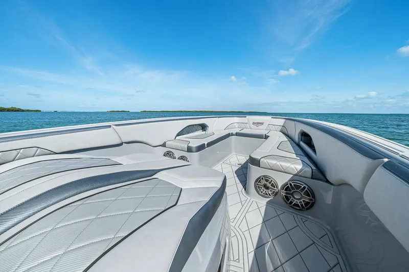 Slide: The Image of 2025 Deep Impact 369 Sport boat interior with luxurious seating on open water. - 7
