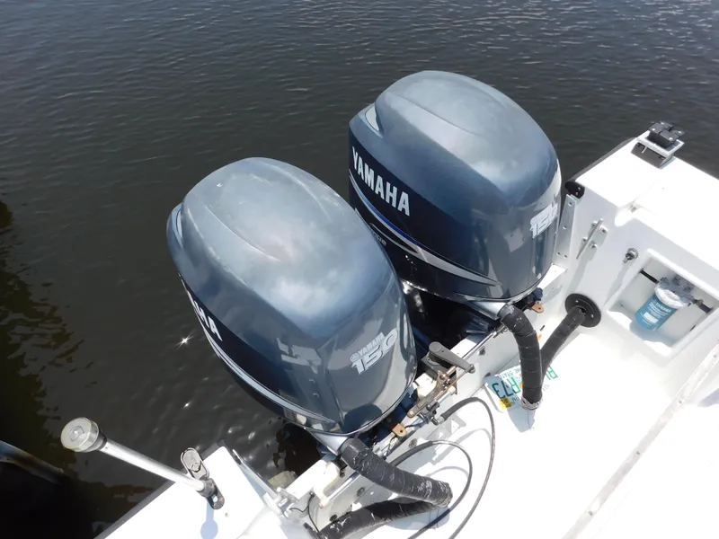Slide: The Image of Twin Yamaha outboard motors on a 1985 Mako 254 Center Console boat. - 13