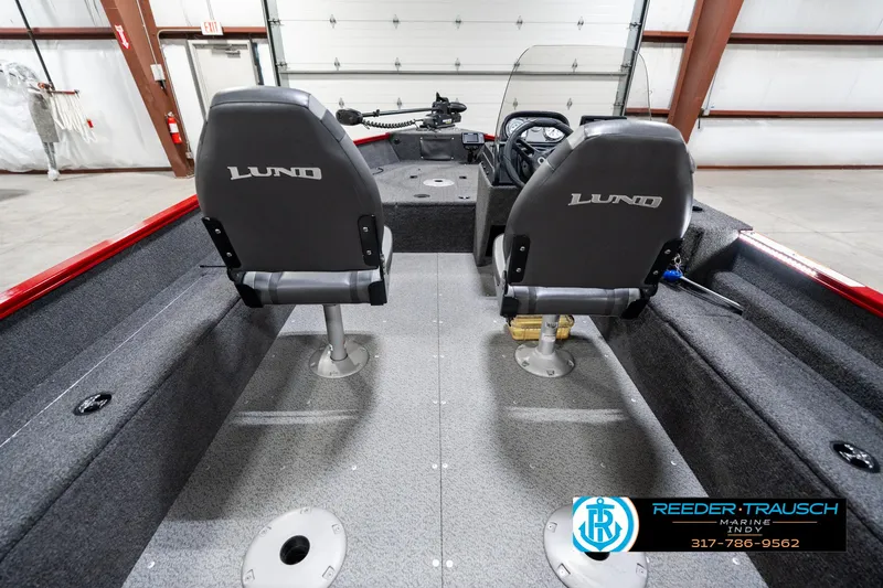 Slide: The Image of 2021 Lund 1650 ANG SS boat interior with two seats and steering console. - 14