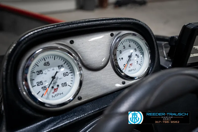 Slide: The Image of Dashboard of 2021 Lund 1650 ANG SS boat with speedometer and tachometer gauges. - 28