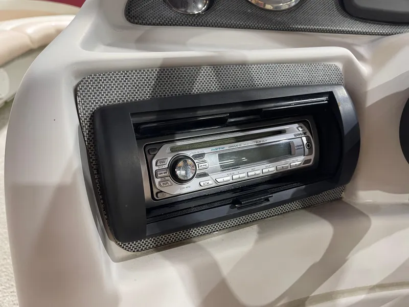 Slide: The Image of Marine stereo system on a 2010 South Bay 520CR boat dashboard. - 19