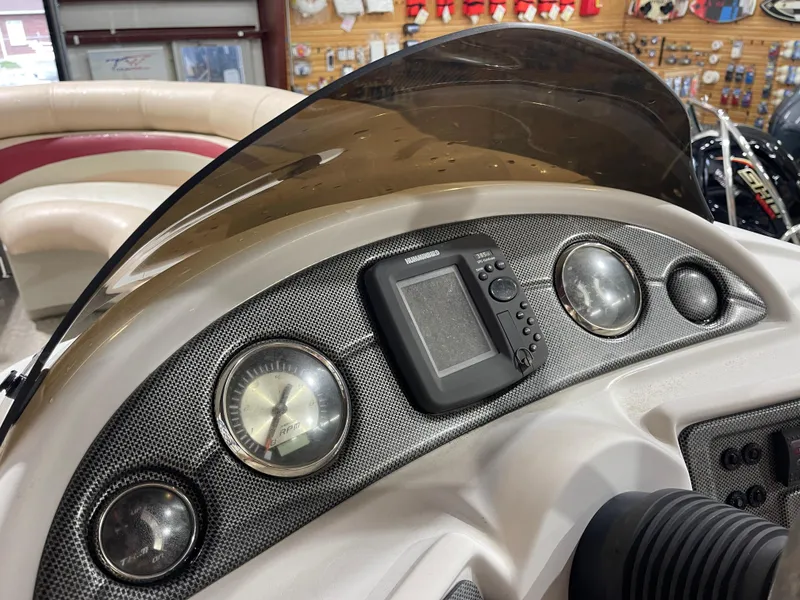 Slide: The Image of Dashboard of a 2010 South Bay 520CR boat with gauges and electronics. - 21