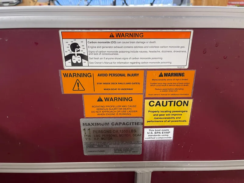 Slide: The Image of Warning labels on a 2010 South Bay 520CR boat, highlighting safety precautions and capacity limits. - 22