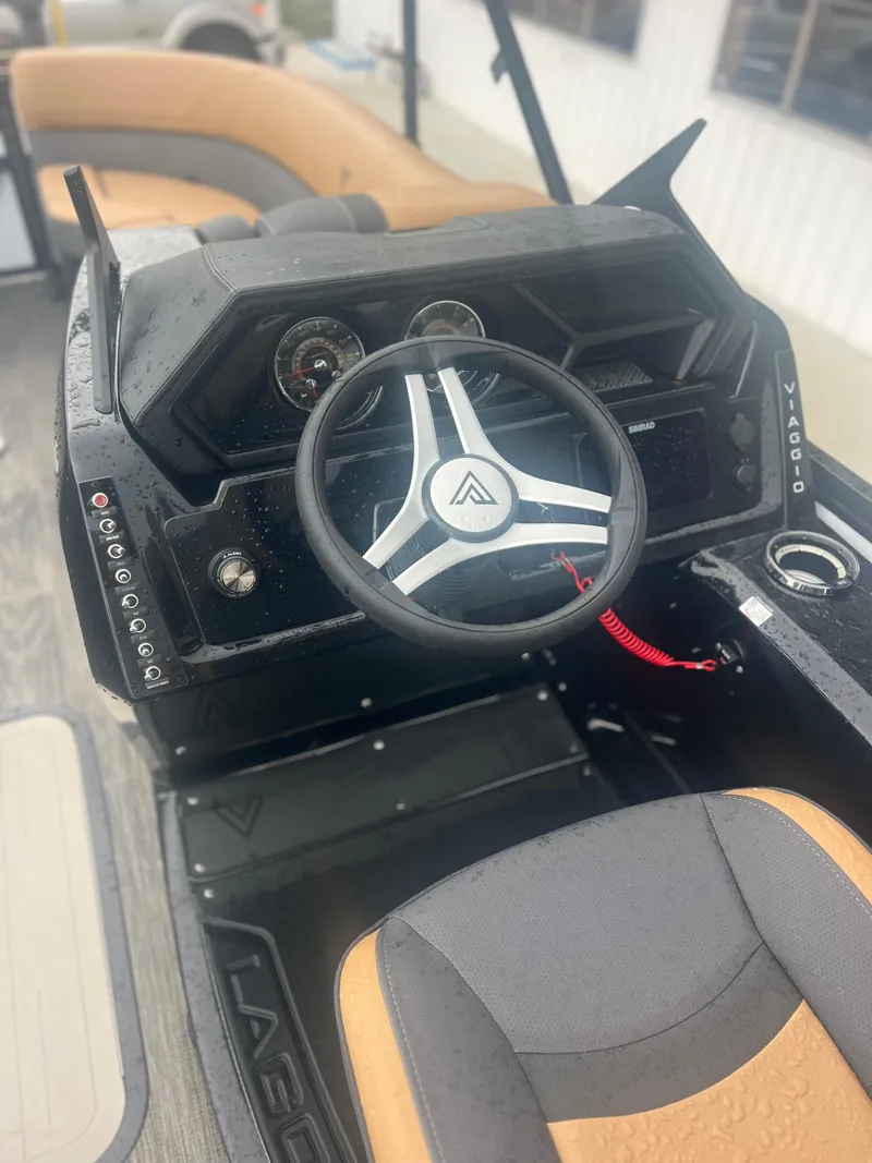 Slide: The Image of 2024 Viaggio Z24S boat dashboard with steering wheel and controls, featuring modern design. - 10