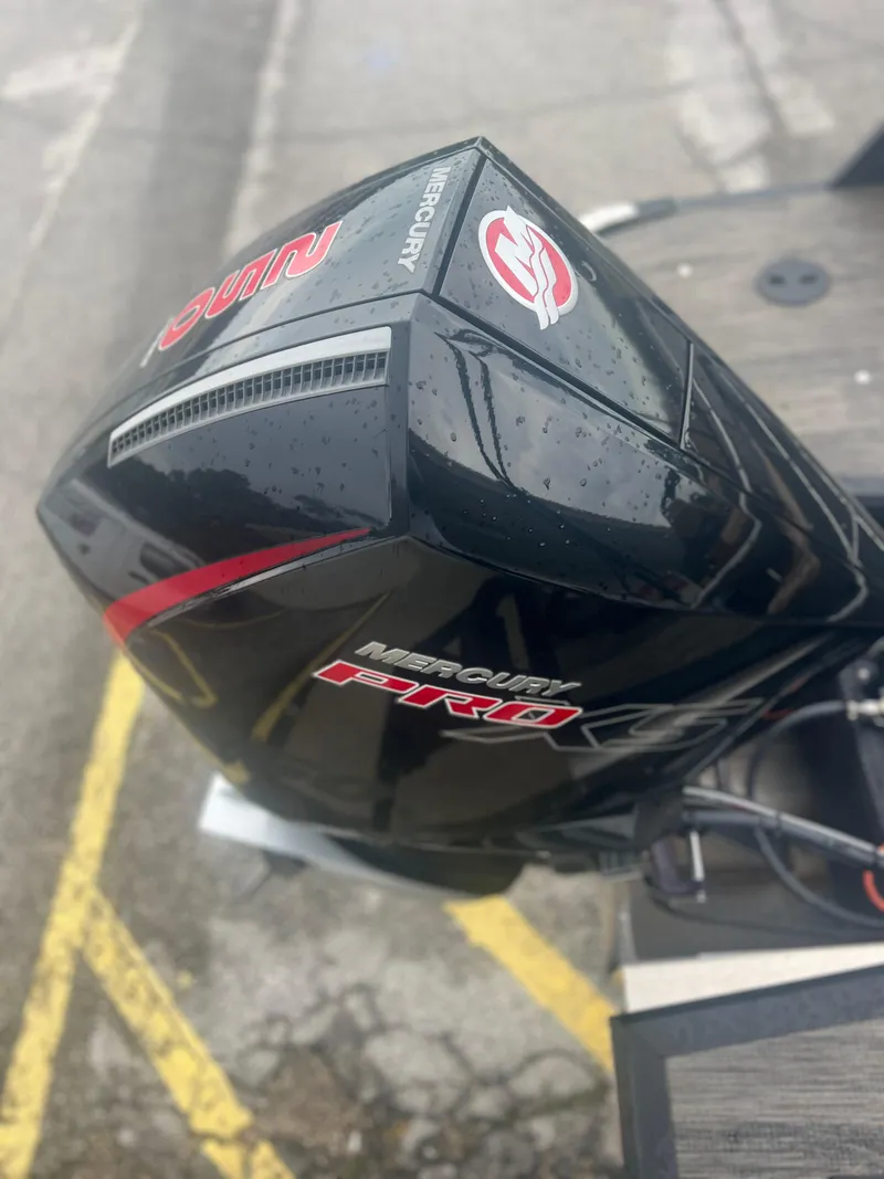 Slide: The Image of 2024 Viaggio Z24S with Mercury Pro XS outboard engine, wet with raindrops. - 16