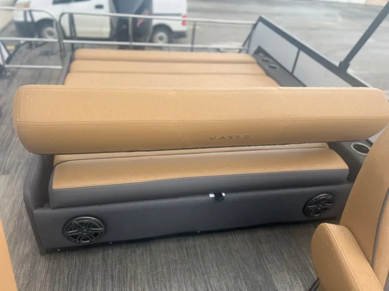 Slide: The Image of 2024 Viaggio Z24S boat interior with tan seating and integrated speakers. - 9