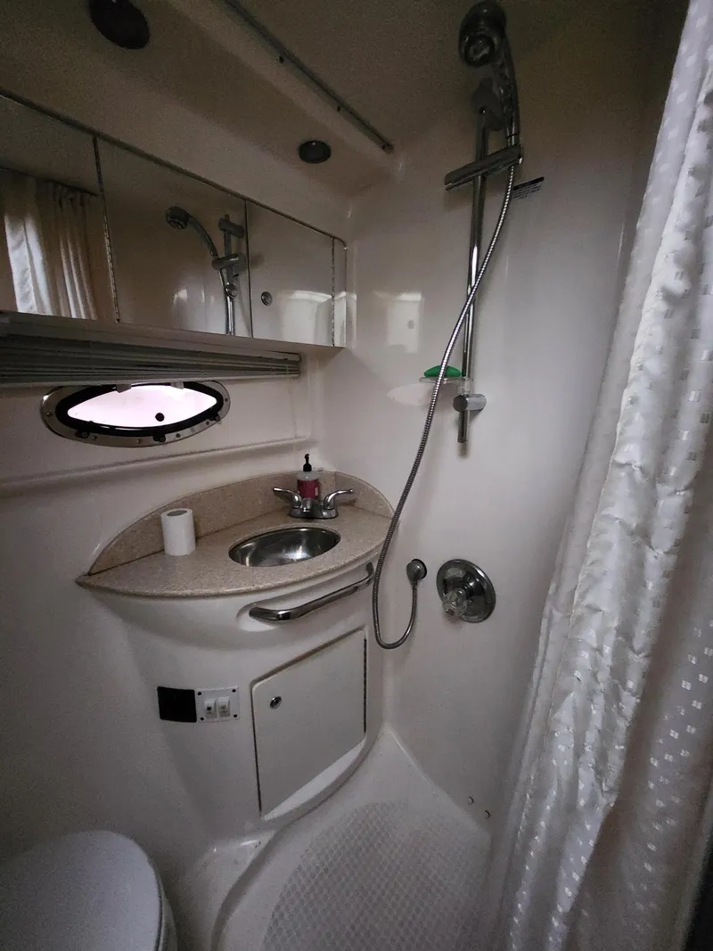 Slide: The Image of 2005 Chaparral Signature 350 bathroom with shower, sink, and mirror. - 12