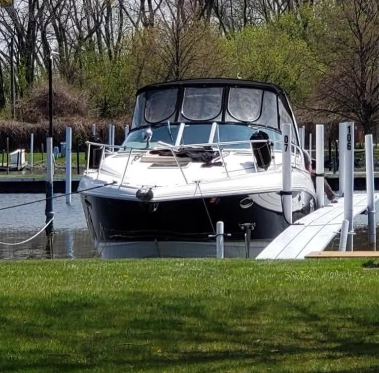 Slide: The Image of 2005 Chaparral Signature 350 boat docked in a serene marina setting. - 4