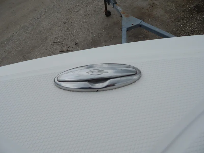 Slide: The Image of 2016 Chaparral 246 SSi boat emblem on textured white surface. - 13