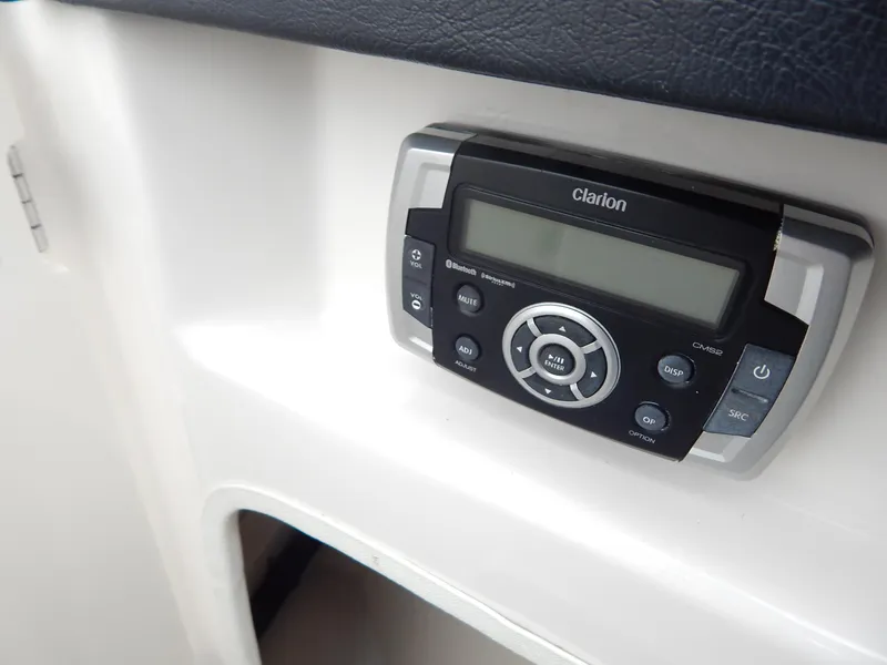 Slide: The Image of Clarion audio system on 2016 Chaparral 246 SSi boat dashboard. - 19