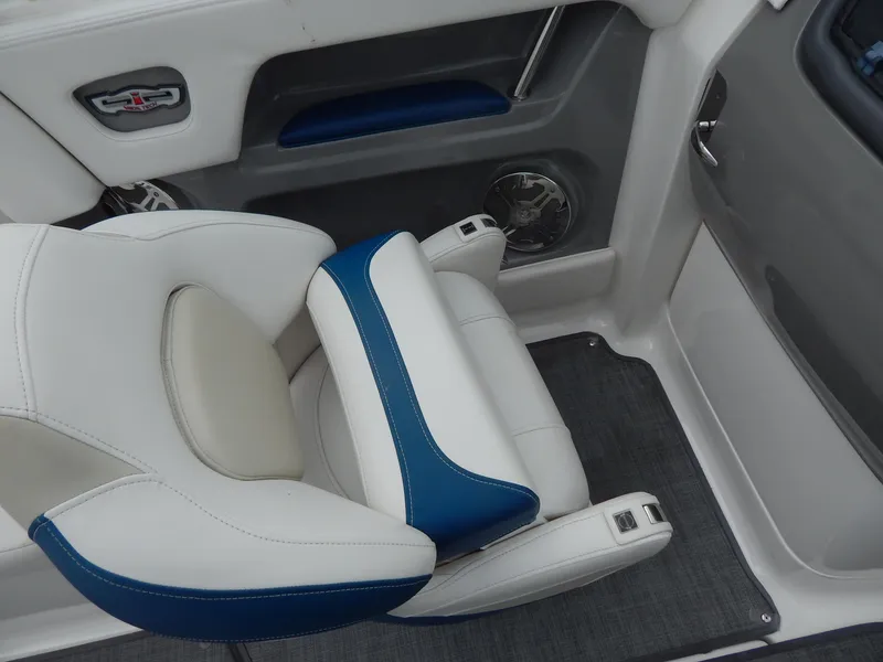 Slide: The Image of 2016 Chaparral 246 SSi boat interior with white and blue seating. - 21