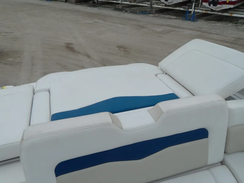 Slide: The Image of 2016 Chaparral 246 SSi boat interior with white and blue seating. - 29