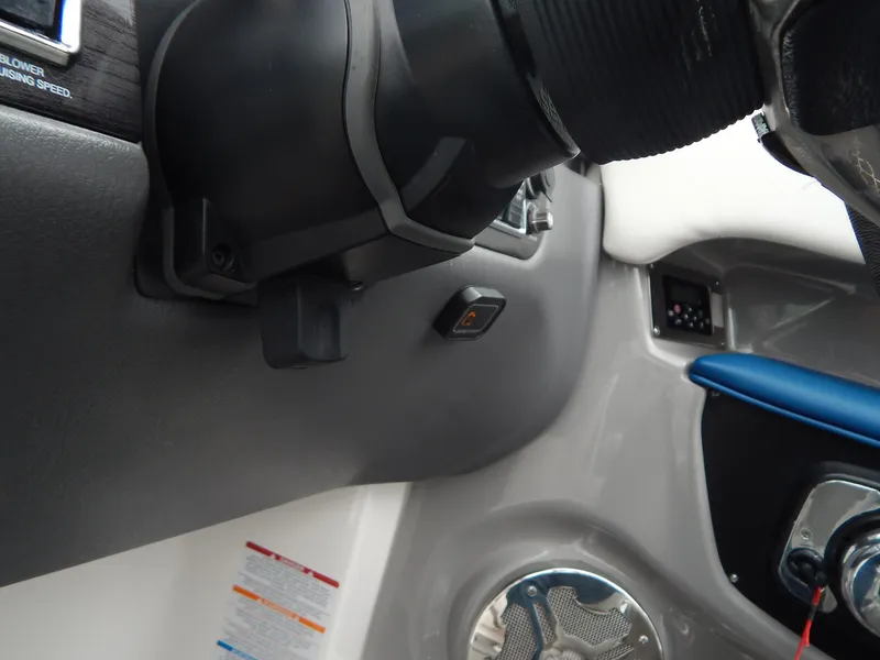 Slide: The Image of Interior dashboard of 2016 Chaparral 246 SSi boat, featuring steering and control panel. - 37