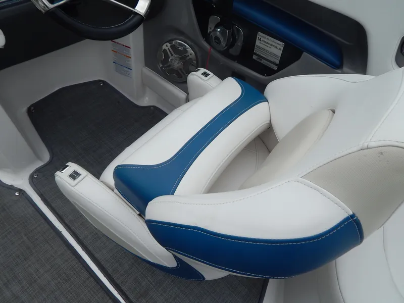 Slide: The Image of 2016 Chaparral 246 SSi boat interior with blue and white seating. - 44
