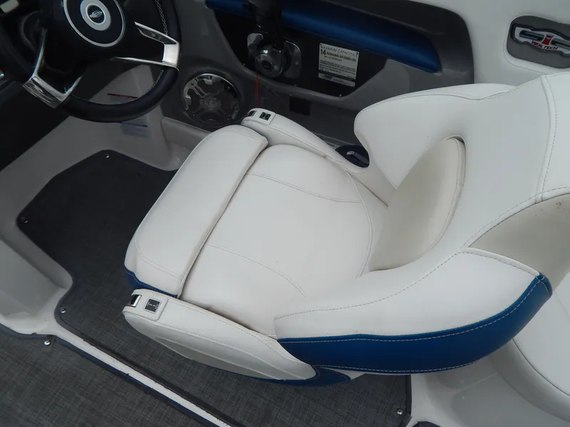 Slide: The Image of 2016 Chaparral 246 SSi boat interior with white and blue seating. - 45