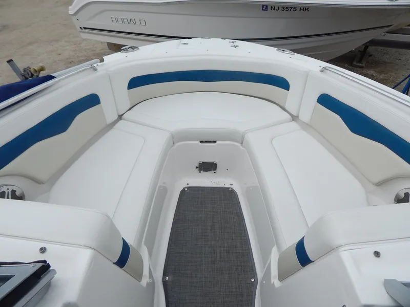 Slide: The Image of 2016 Chaparral 246 SSi boat interior with white and blue seating. - 9