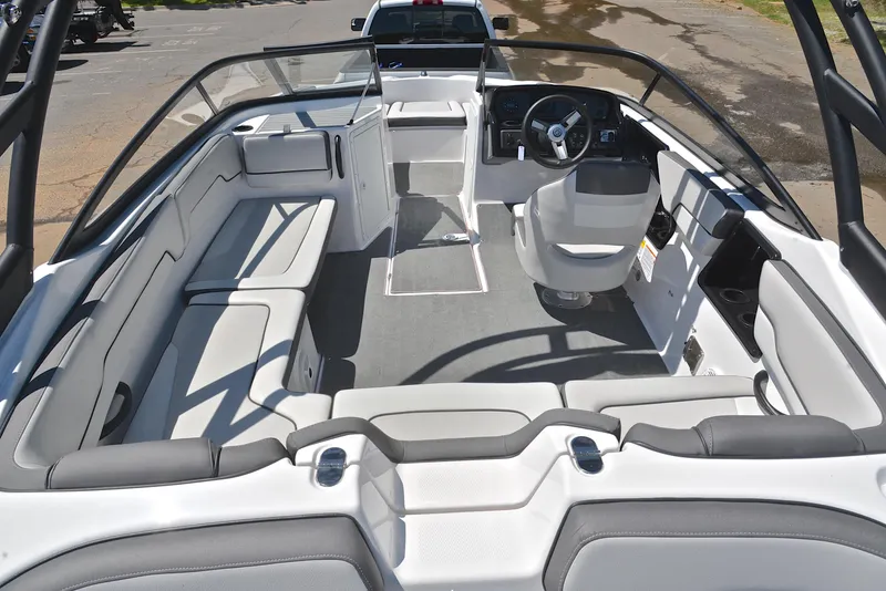 Slide: The Image of 2023 Yamaha Boats AR190 interior with spacious seating and modern helm design. - 18