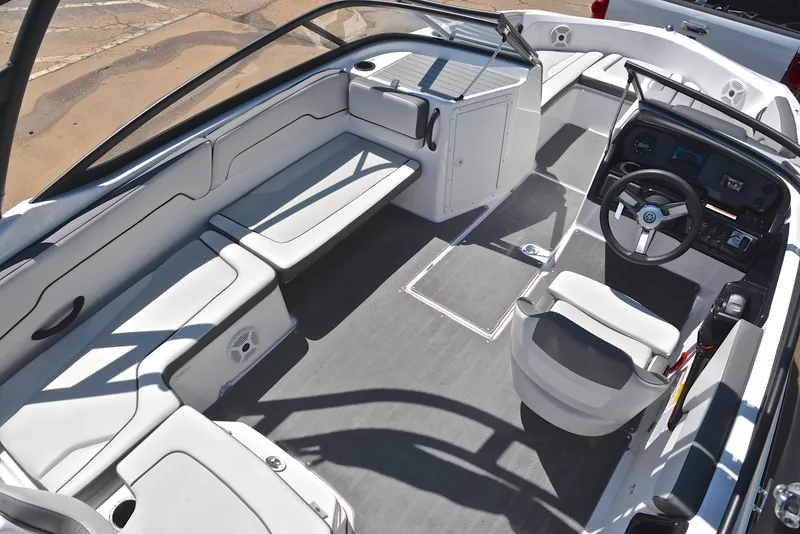 Slide: The Image of 2023 Yamaha Boats AR190 interior with sleek seating and modern dashboard design. - 19
