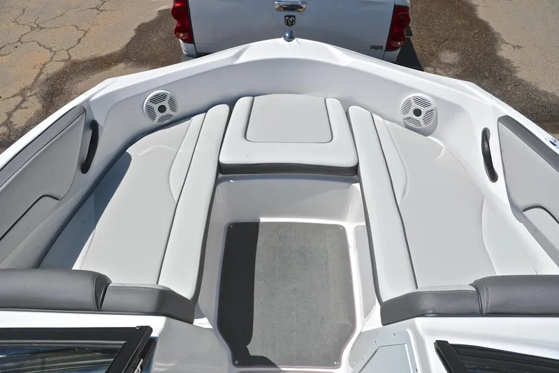 Slide: The Image of 2023 Yamaha Boats AR190 interior with cushioned seating and speakers. - 21
