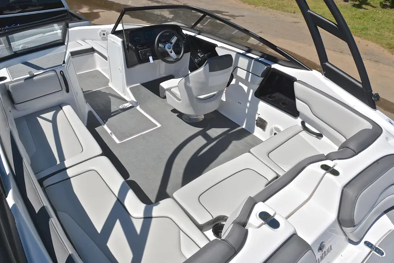 Slide: The Image of 2023 Yamaha Boats AR190 interior with sleek seating and modern dashboard design. - 23