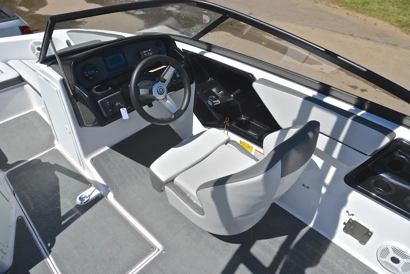 Slide: The Image of 2023 Yamaha Boats AR190 cockpit with steering wheel and seating. - 24