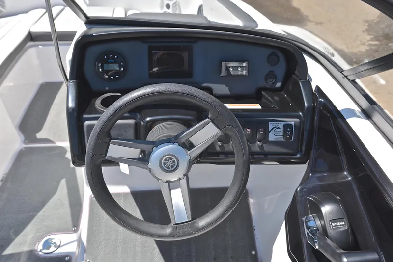 Slide: The Image of 2023 Yamaha Boats AR190 dashboard with steering wheel and control panel. - 25