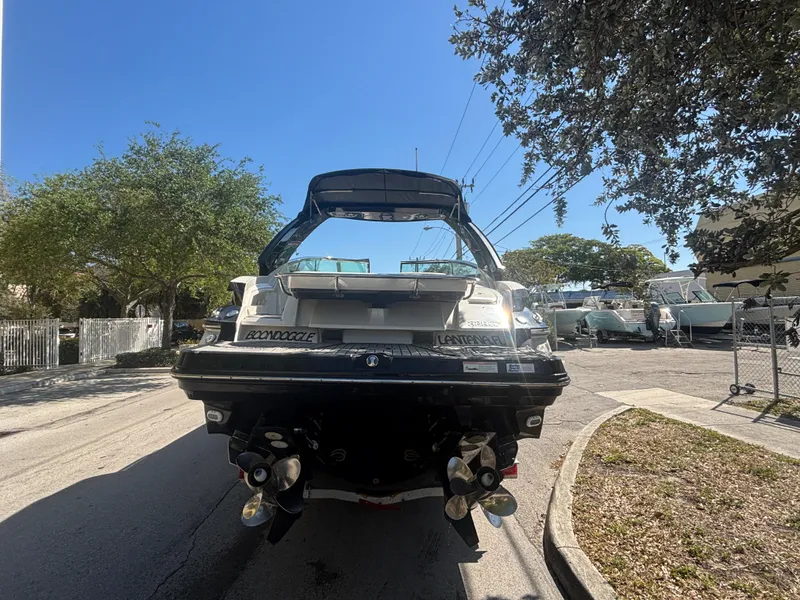 Slide: The Image of 2014 Monterey 328 Super Sport boat parked on a sunny street. - 4