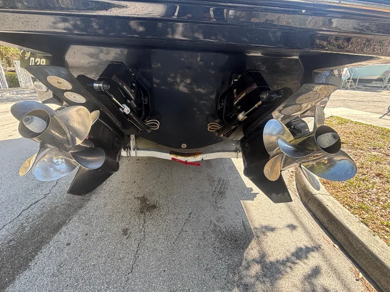 Slide: The Image of 2014 Monterey 328 Super Sport boat propellers on a trailer, showcasing dual stainless steel props. - 5