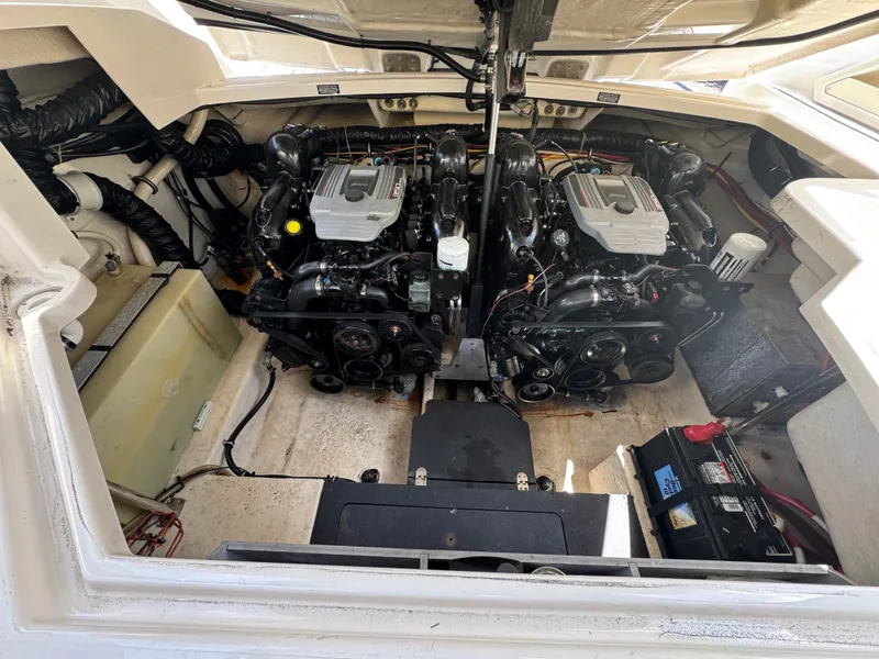 Slide: The Image of Engine compartment of a 2014 Monterey 328 Super Sport boat, showcasing dual engines. - 8
